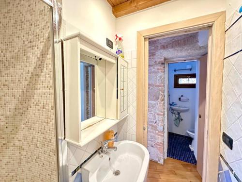 a bathroom with a sink and a mirror at Oasi in Poggio Moiano