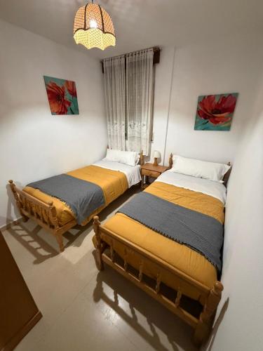 a room with two beds in a room at Salvora in Bueu