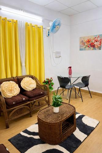 a living room with a couch and a table at Elite Hostel- SB Road Pune in Pune