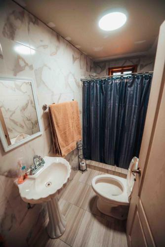 a bathroom with a sink and a toilet and a shower at Mexiquillo - La Fogata - Cabin #5 in La Ciudad