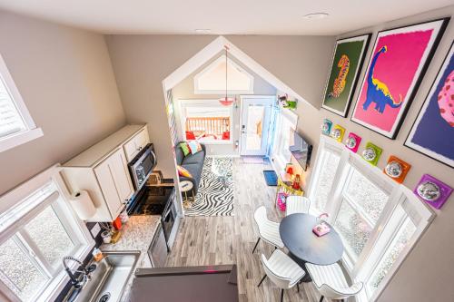 an overhead view of a small living room with a table at Rainforest Tiny Home Retreat #17 Abstract Modern in Forks