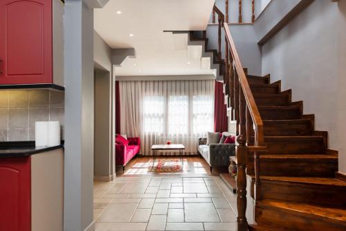 a living room with a staircase and a couch at Bright Apart Hotel in Istanbul