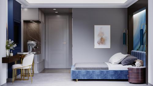 a bedroom with a bed and a desk and a chair at Three Corners Hotel in Skopje