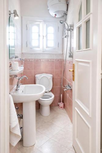 a bathroom with a toilet and a sink at Paradise Villa - King Mariout in King Mariout