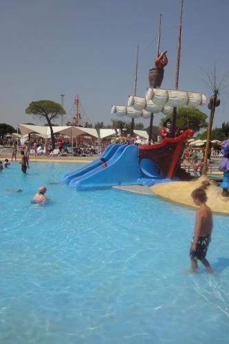 a group of people in the water at a water park at CASA ROMAN ITALIA, Center Sacile in Sacile