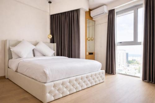 Llit o llits en una habitació de RARA HM Suites