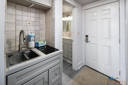 a kitchen with a sink and a faucet at Pirates Bay A108 in Fort Walton Beach
