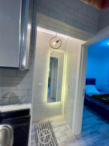 a bathroom with a mirror and a sink at Ras Sedr in Ras Sedr