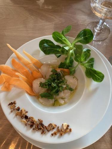 a plate of food with vegetables on a table at Ker Gwezenn in Tramain