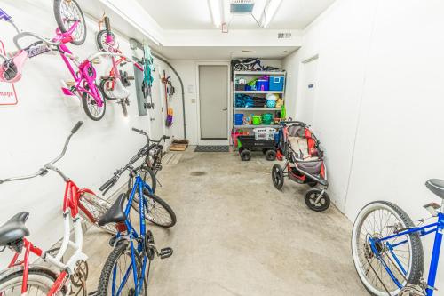 a garage with bikes hanging on the wall at Sand On My Toes in Seaside