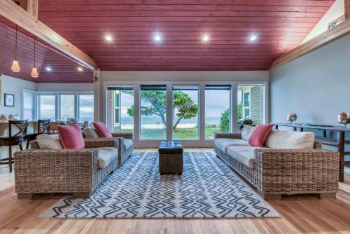 a living room with two couches and a table at Oceans Edge in Lincoln City