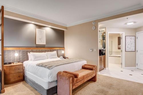 a bedroom with a large bed and a bathroom at MGM Signature Luxury Jr Suite with Balcony Strip and Sphere Views in Las Vegas
