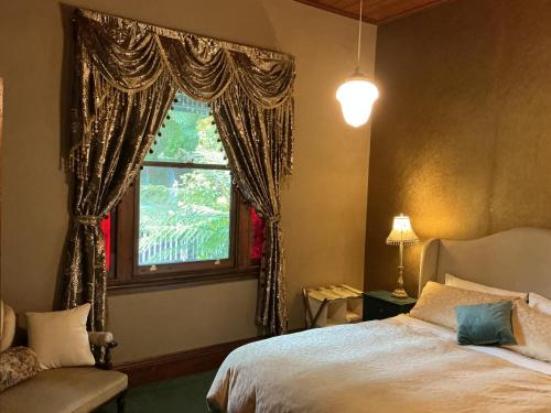 a bedroom with a bed and a window at Bromwich Guest House - 250m to town centre! in Blackwood