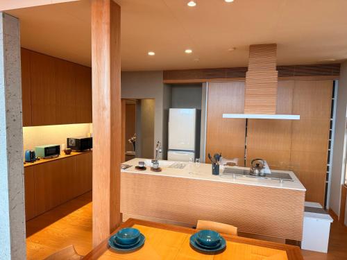 a kitchen with a sink and a counter top at the Mikuni Residence in Sakai