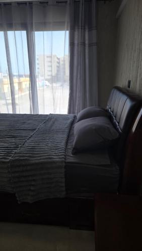 A bed or beds in a room at Ocean View Studio 1