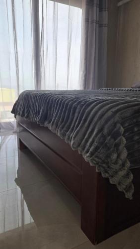 A bed or beds in a room at Ocean View Studio 1