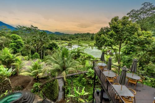 a view of the river from the balcony of a resort at Sweet Escape - Boutique Hotel in Sidemen