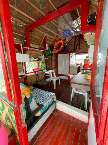 a room with a bed and a desk and a table at Check beth in Puerto Princesa City