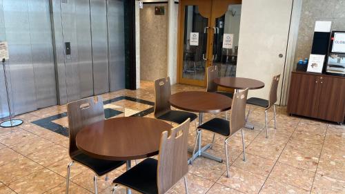 a couple of tables and chairs in a room at Toyoko Inn Hakata-eki Minami in Fukuoka