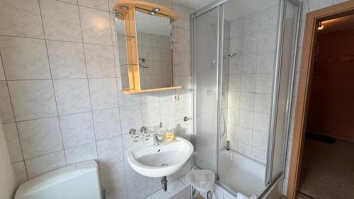 a bathroom with a sink and a toilet and a shower at Die Grenzburg in Güstrow