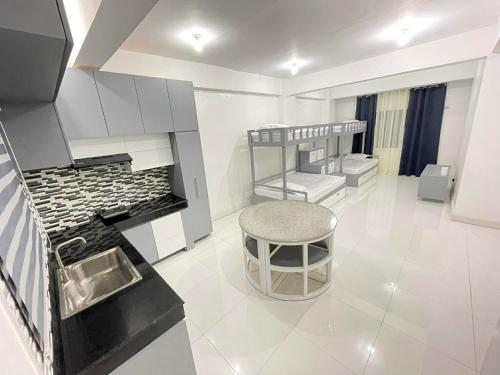 a kitchen with a counter and a stool in a room at Host Homes RM201 Independencia St in San Fernando