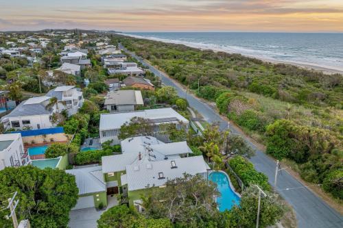 an aerial view of a house and the beach at Beachside Bliss - Ocean View, Pool, Sauna in Peregian Beach