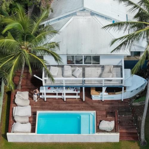 an aerial view of a house with a swimming pool at Summer House Magnetic Island in Arcadia
