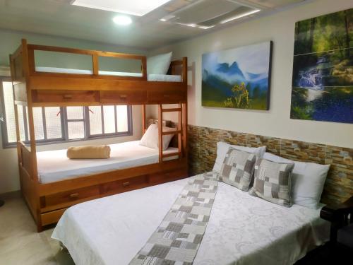 a bedroom with two bunk beds at HOUSE IBIS Salento in Salento