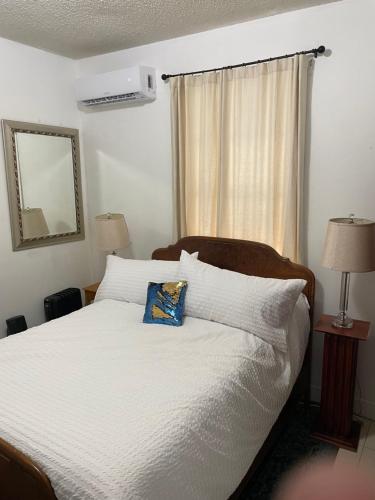 a bedroom with a bed with a pillow on it at Traditional Nola in New Orleans