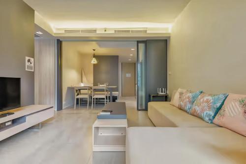 a living room with a couch and a table at Circle S Sukhumvit 12 Bangkok in Bangkok