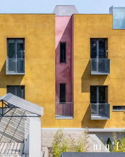 a building with colorful paint on the side of it at Hotel Ingrid Gunsan in Gunsan-si