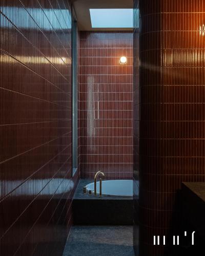 a bathroom with a shower and a bath tub at Hotel Ingrid Gunsan in Gunsan-si
