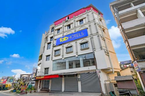 a building with a sign on the side of it at FabHotel Iubit in kolkata