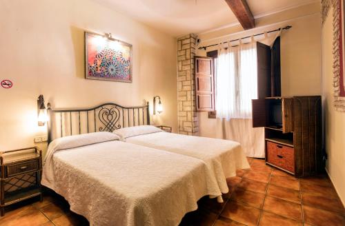 Postel nebo postele na pokoji v ubytování Arte Vida Suites & Spa