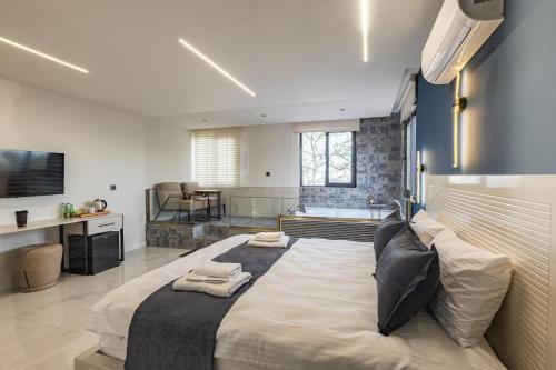 a bedroom with a large bed with two towels on it at Safir Termal & Spa Otel in Çekirge İstasyonu