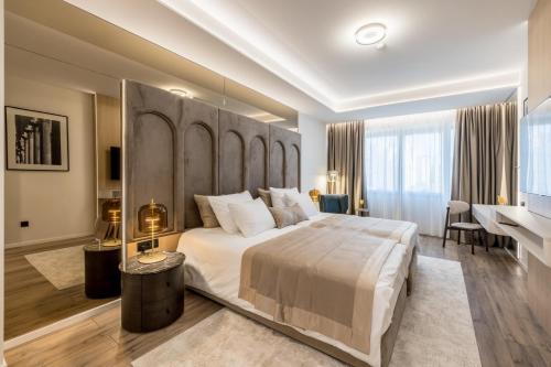 Llit o llits en una habitació de Hotel Atrium