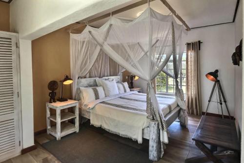 Llit o llits en una habitació de Olerai Lodge