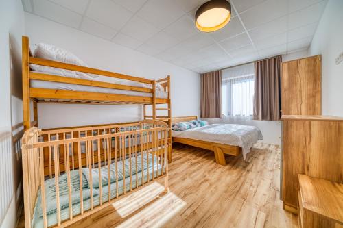 a bedroom with two bunk beds in it at Vila SIGORD in Kokošovce