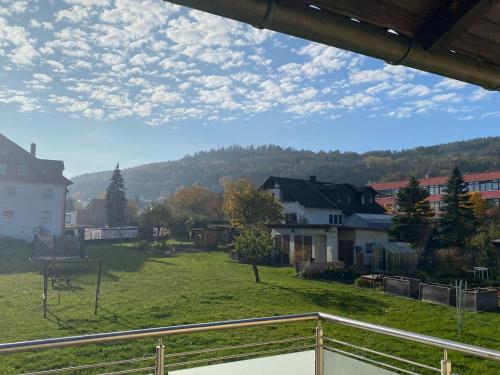 a view of a town with a field and houses at Ferienwohnung am Breitenbach in Ebermannstadt