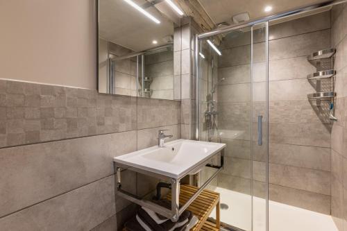 a bathroom with a sink and a shower at Montauvert in Montel-de-Gelat