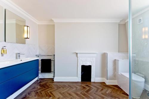 a bathroom with a sink and a toilet at Imperial York Street Apartments in London