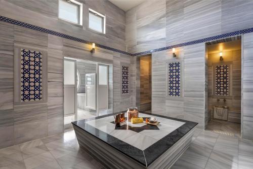 a room with a table with food on it at Limak Lara Deluxe Hotel & Resort Antalya in Lara
