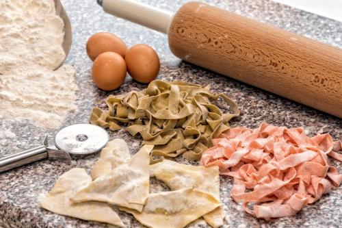 a counter with tortilla chips and eggs and a knife at Hotel Armin in Selva di Val Gardena