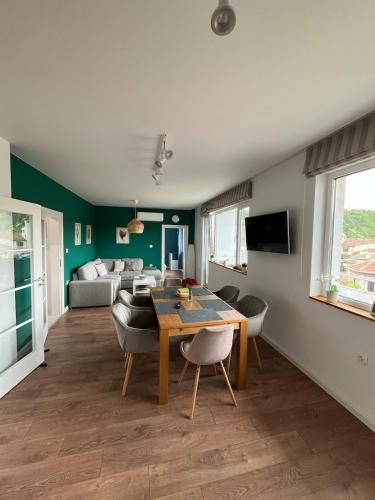 a living room with a table and a couch at Green view 180 in Troyan