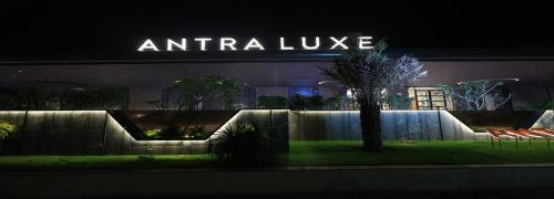 a building with a sign that reads antifa luxury at Antra Luxe in Anumalkudūru