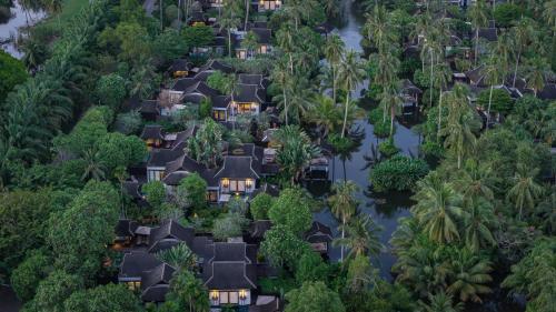 an aerial view of a village in the jungle at Anantara Mai Khao Phuket Villas in Mai Khao Beach
