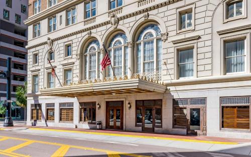 a building with an american flag in front of it at Hotel Flor Tampa Downtown, Tapestry Collection By Hilton in Tampa