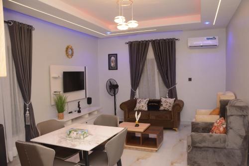 a living room with a table and a couch at KLSApartment in Lagos