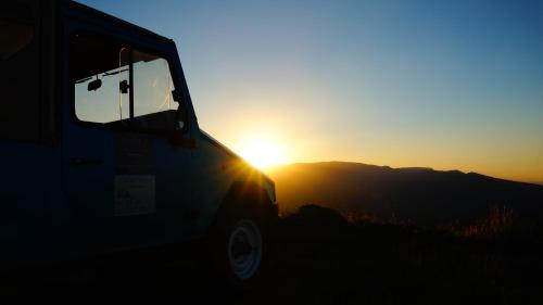 a truck parked in front of the sunset at Casa da Quelha in Chãs de Égua