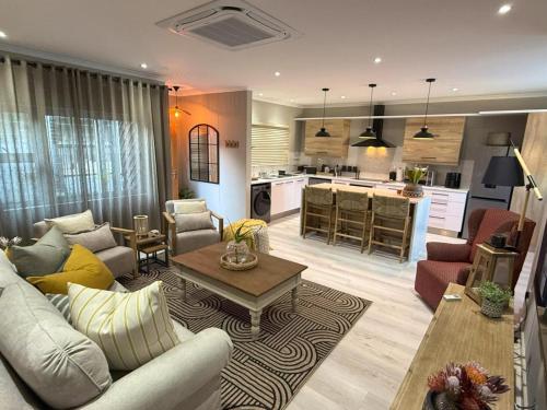 a living room with a couch and a table at 20 At Jeanette in Windhoek
